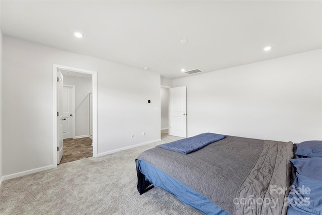 bedroom with light colored carpet