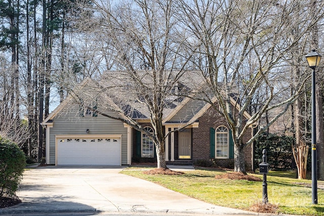 front facade featuring a garage and a front lawn