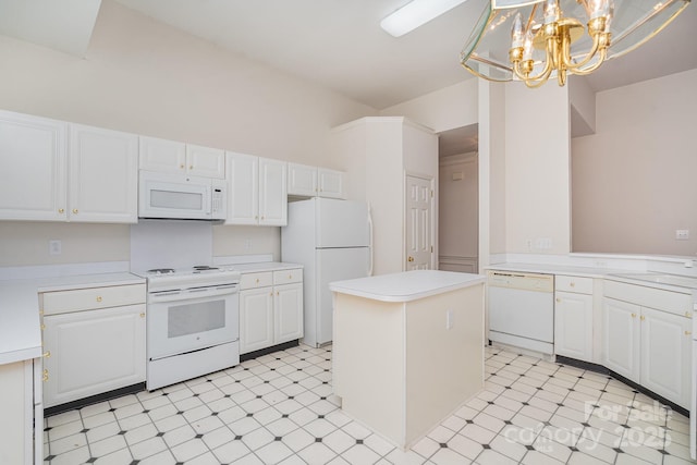 kitchen with white cabinetry, white appliances, decorative light fixtures, and a kitchen island