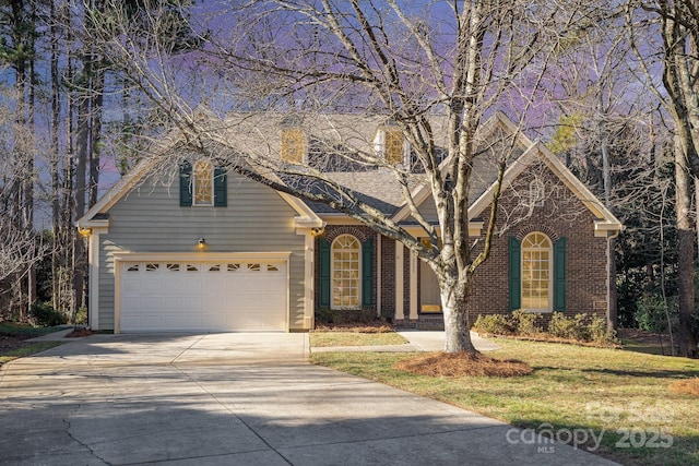 front of property featuring a garage and a front lawn