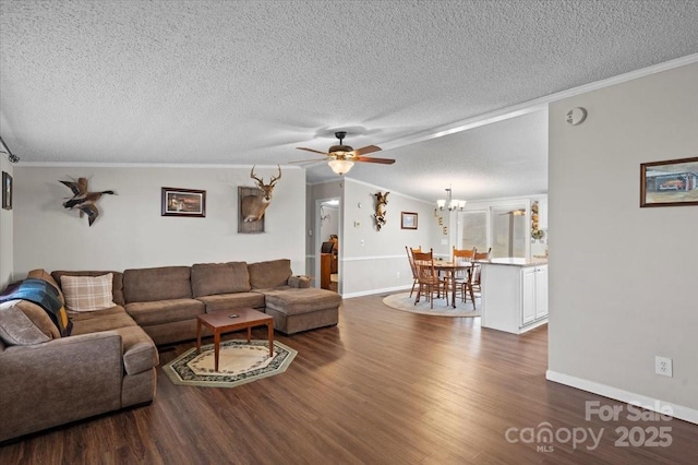 living room with ornamental molding, dark hardwood / wood-style flooring, and a textured ceiling