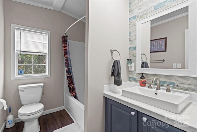 full bathroom with wood-type flooring, toilet, vanity, and shower / bath combo