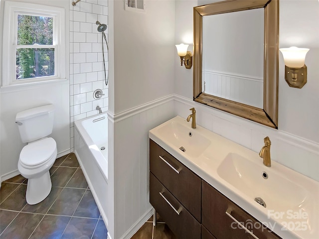 full bathroom with tile patterned flooring, vanity, shower / tub combination, and toilet