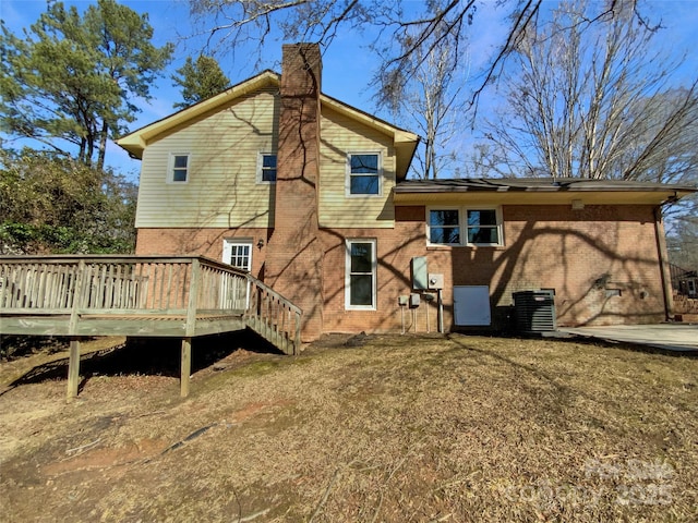 back of property featuring a wooden deck and central air condition unit