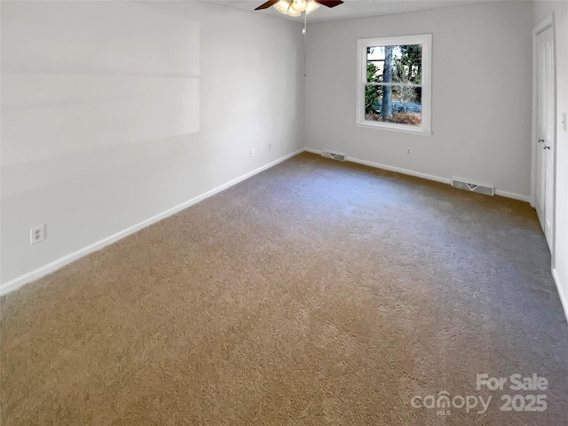 unfurnished room with carpet flooring and ceiling fan