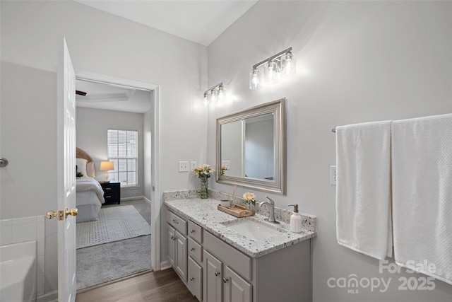 bathroom with vanity and hardwood / wood-style floors