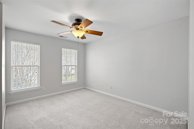 unfurnished room featuring ceiling fan and light carpet