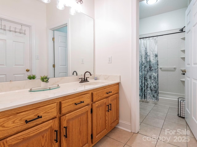 bathroom with shower / bath combination with curtain, vanity, and tile patterned flooring