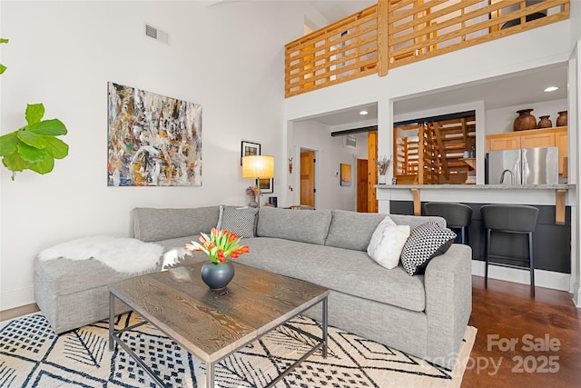 living room with a high ceiling