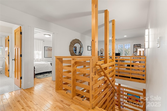 stairway featuring wood-type flooring