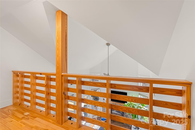 interior space with lofted ceiling and hardwood / wood-style floors