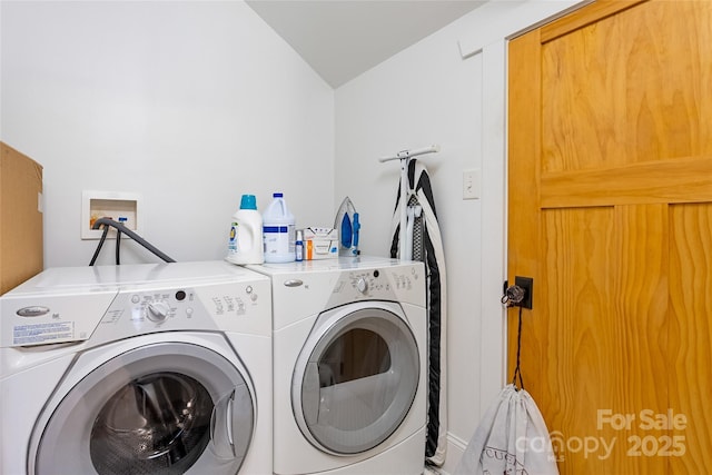 clothes washing area featuring washing machine and clothes dryer