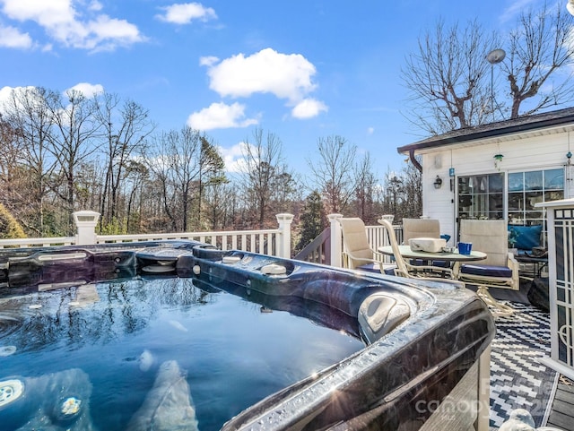 view of pool featuring a hot tub