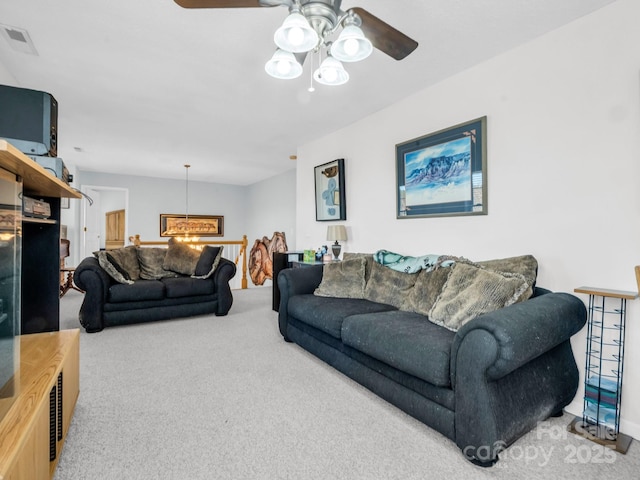 carpeted living room featuring ceiling fan