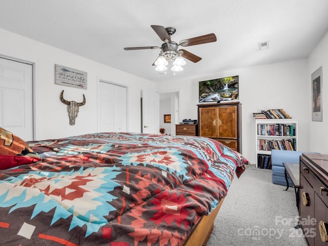 carpeted bedroom with ceiling fan