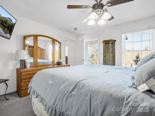 bedroom with light carpet and ceiling fan