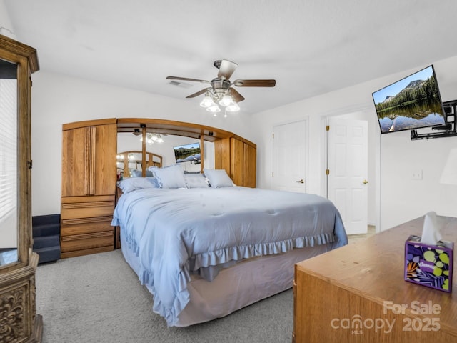 carpeted bedroom with ceiling fan