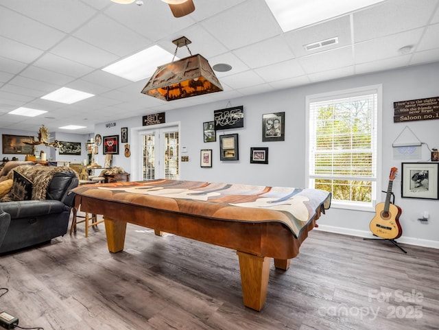 rec room featuring french doors, pool table, hardwood / wood-style floors, and a drop ceiling