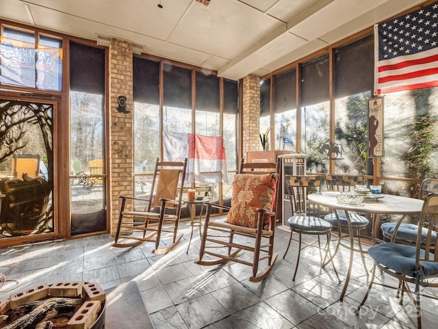 sunroom featuring a healthy amount of sunlight