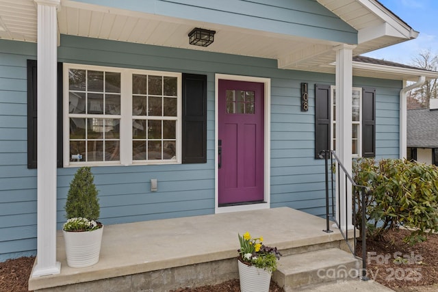 doorway to property featuring a porch