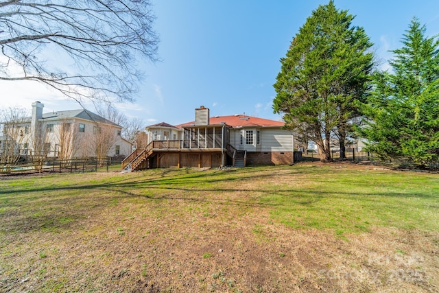 back of property with stairway, fence, a yard, a sunroom, and crawl space