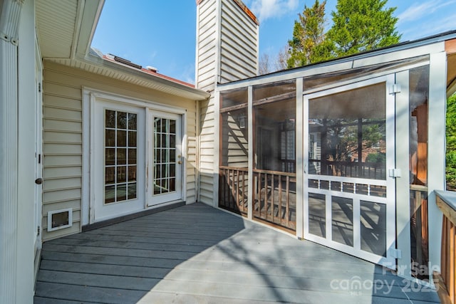 wooden terrace with a sunroom