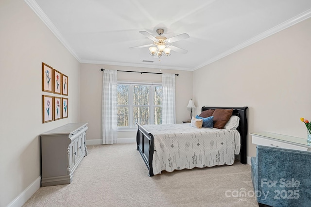 bedroom featuring light carpet, baseboards, ornamental molding, and ceiling fan