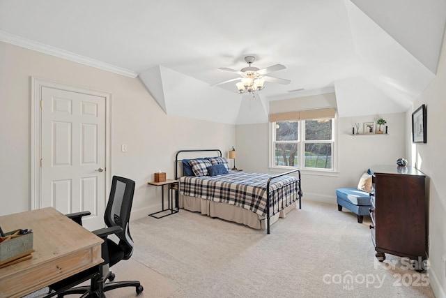 bedroom featuring light carpet, vaulted ceiling, and crown molding