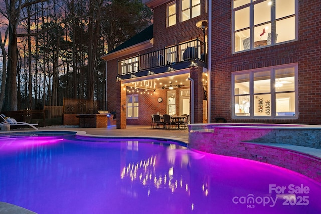 pool with a patio