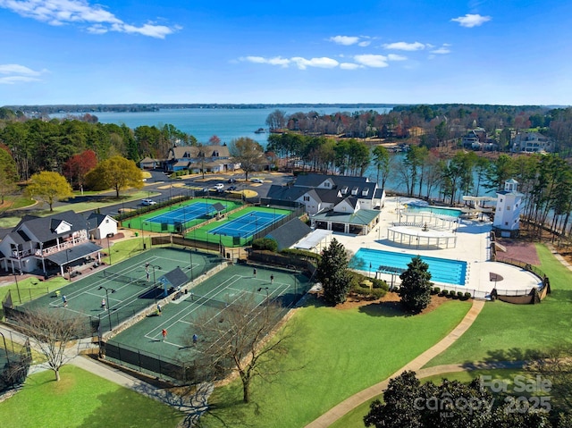 birds eye view of property with a water view