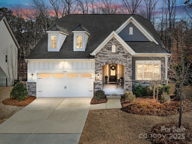 view of front of property featuring a porch and a garage