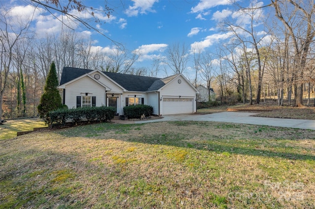 ranch-style home featuring a garage and a front yard