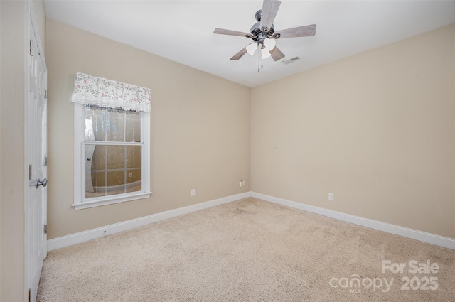 carpeted empty room featuring ceiling fan