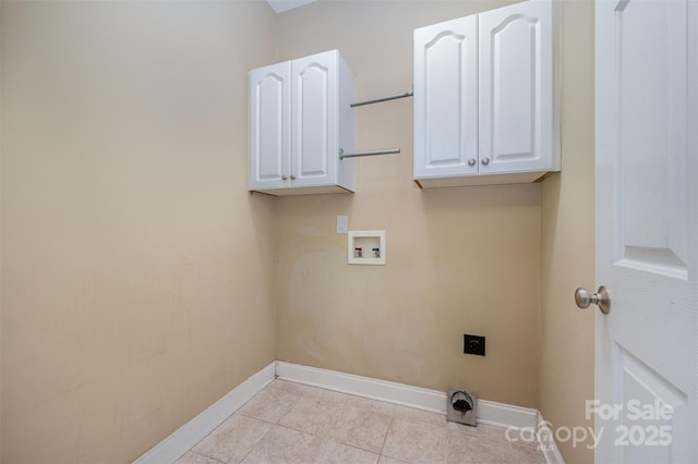 washroom with cabinets, washer hookup, electric dryer hookup, and light tile patterned floors