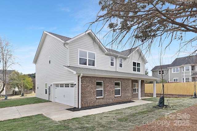 view of front of house featuring fence, an attached garage, a front lawn, concrete driveway, and brick siding