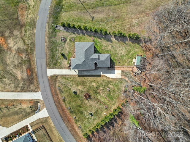 birds eye view of property with a rural view