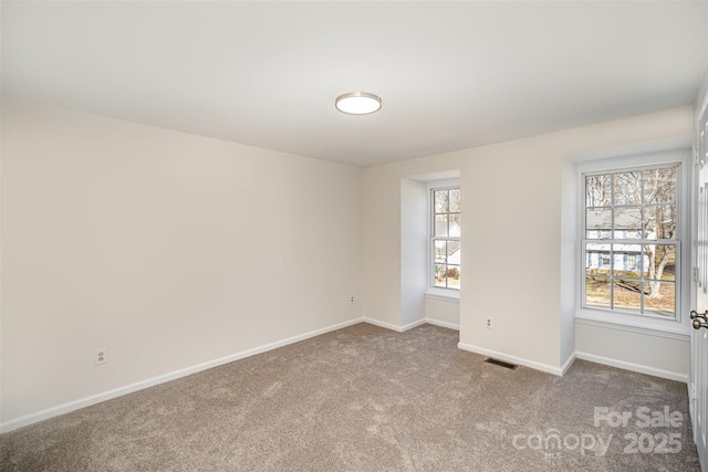 empty room with light colored carpet