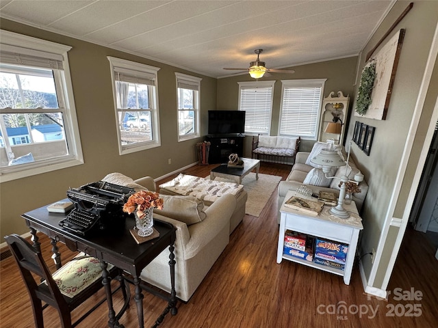 living room with crown molding, dark hardwood / wood-style floors, and ceiling fan