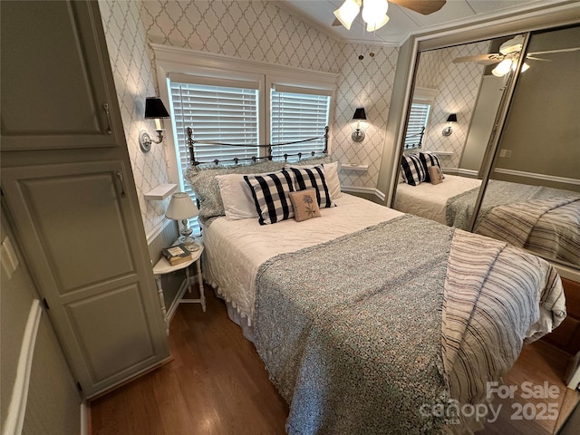 bedroom with light hardwood / wood-style floors, a closet, and ceiling fan