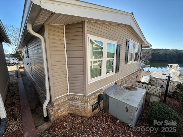 view of property exterior featuring a water view