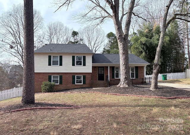 tri-level home featuring a front yard