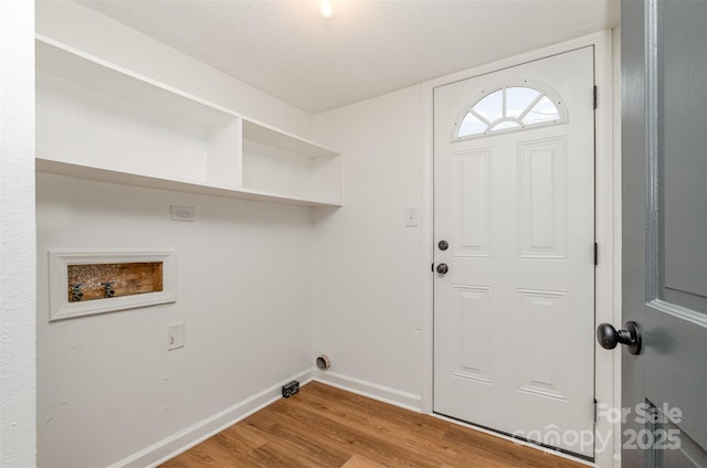 laundry room with hookup for a washing machine and light wood-type flooring