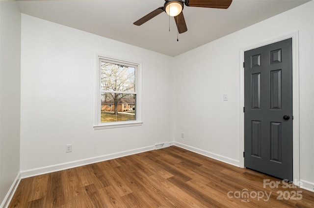 unfurnished room with hardwood / wood-style flooring and ceiling fan