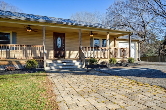 view of front of home featuring ceiling fan and covered porch