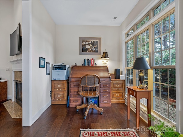 home office with dark wood-type flooring