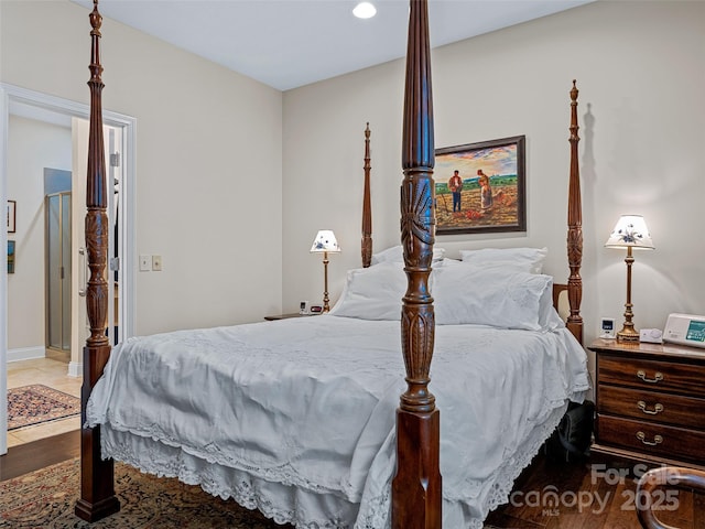 bedroom with hardwood / wood-style flooring