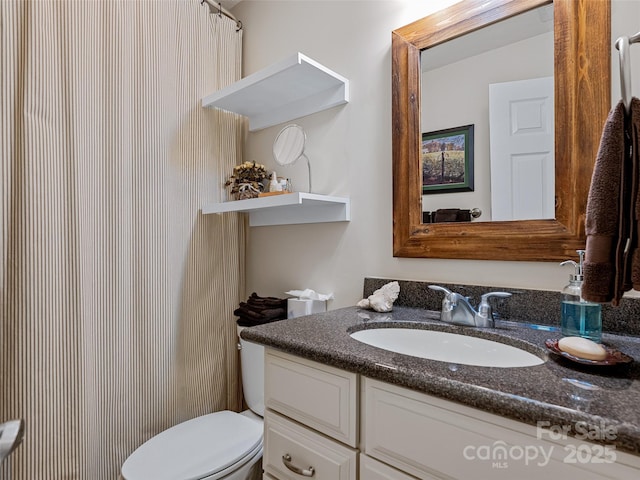 bathroom with vanity and toilet