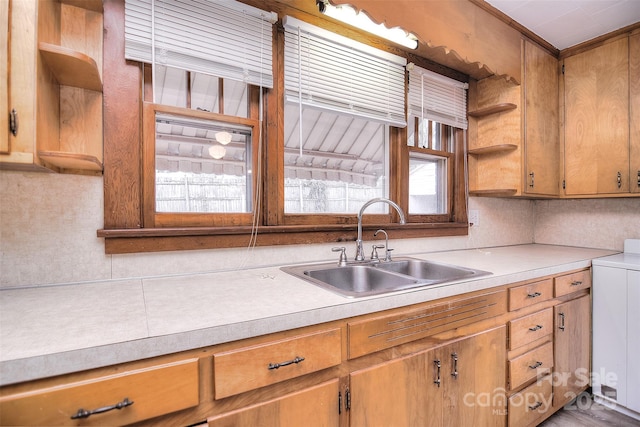 kitchen featuring sink and washer / clothes dryer