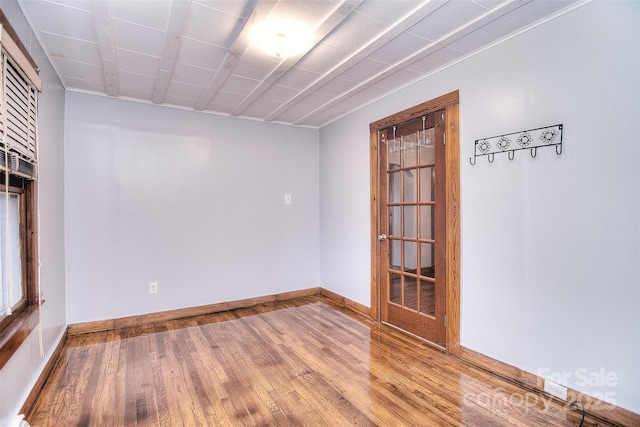 spare room featuring hardwood / wood-style flooring