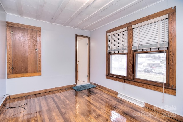 unfurnished room featuring wood-type flooring